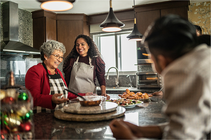 A family celebrating around a table of food.