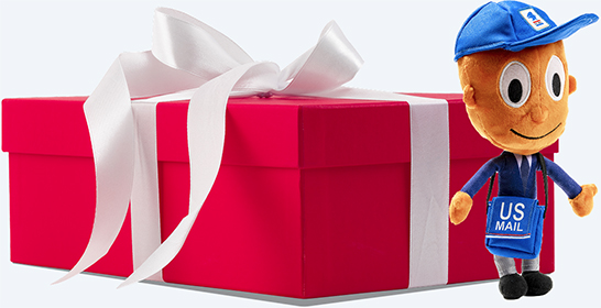 A Mr. ZIP plush next to a red box with a white bow.